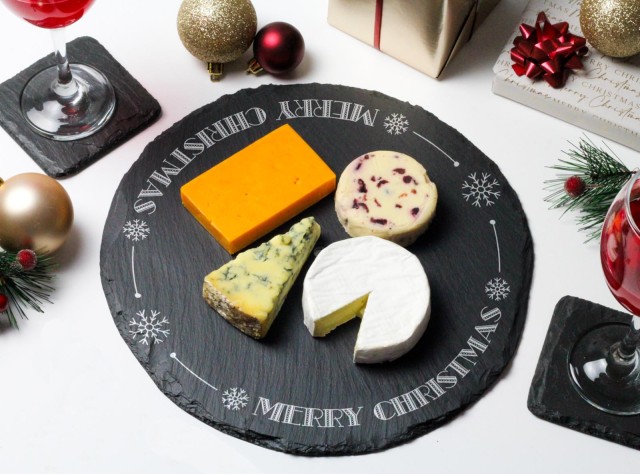 Round welsh slate cheeseboard laser engraved with the words Merry Christmas